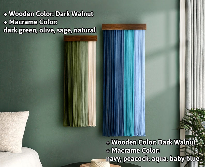 May include: Two macrame wall hangings with dark walnut wooden tops. One features dark green, olive, sage, and natural colored macrame. The other displays navy, peacock, aqua, and baby blue macrame. Both are displayed against a green wall.