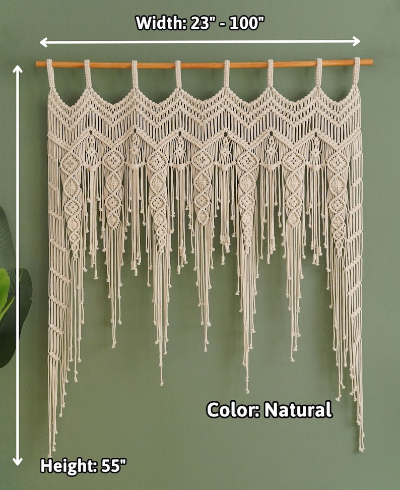 May include: A natural-colored macrame wall hanging with a scalloped top and fringe. The hanging measures 55 inches in height and 23 to 100 inches in width.