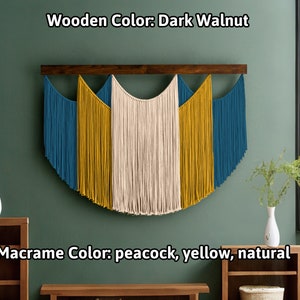 May include: A macrame wall hanging with a dark walnut wooden bar. The macrame features peacock, yellow, and natural colors. The text on the image reads "Wooden Color: Dark Walnut" and "Macrame Color: peacock, yellow, natural."