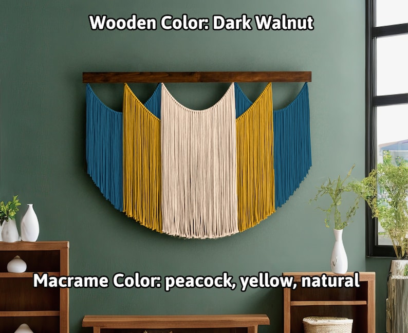 May include: A macrame wall hanging with a dark walnut wooden bar. The macrame features peacock, yellow, and natural colors. The text on the image reads "Wooden Color: Dark Walnut" and "Macrame Color: peacock, yellow, natural."