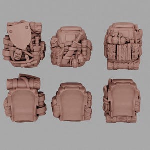 May include: Six miniature brown backpacks, each with varying details. Some have pouches, straps, and what appears to be a shield-like element. The backpacks are arranged in two rows of three, showcasing different angles and designs.