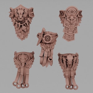 May include: Five brown, intricately detailed fantasy armor pieces. The designs include animal skulls, feathers, and geometric shapes. The pieces appear to be decorative or for cosplay, with a focus on a tribal or warrior theme.