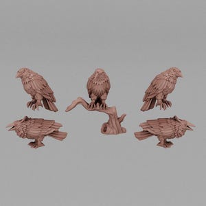 May include: A collection of five brown raven figurines in various poses. One raven is perched on a branch, while the others stand or crouch. The figurines have detailed feather textures and are set against a neutral background.