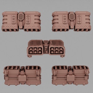 May include: Five tan-colored, futuristic-looking model components. The components have a rectangular shape with various details, including cylindrical sections, etched symbols, and a series of small, round protrusions. One component features multiple circular openings, suggesting a missile launcher.