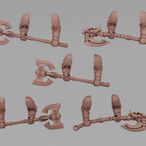 May include: A collection of miniature axes, each with a detailed design. The axes have a brown color and feature intricate patterns on the blades and handles. Some axes have a skull design. The image is set against a neutral background.