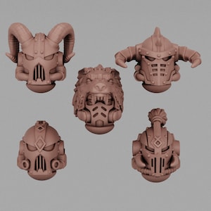 May include: Five different 3D printed helmet designs for miniature figures. The helmets are in a light brown color and feature various details, including horns, spikes, and a wolf's head.