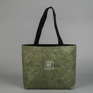 May include: A green tote bag with black straps and a white logo that says "CHA CHA CHA Los Angeles".
