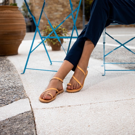 Put your best foot forward this season when you step out in these Bevelia strappy  toe ring sandals. 💫🤎 | Instagram