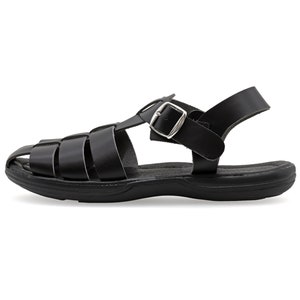 May include: Black leather sandal with a woven upper design and a buckle closure. The sandal has a thick sole and an adjustable ankle strap. The sandal is designed for comfort and durability.