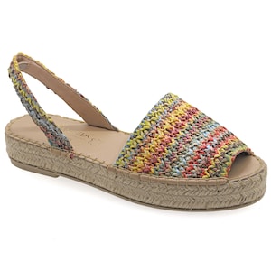 May include: A colorful woven sandal with a slingback strap. The open-toe shoe features a multi-colored upper in shades of yellow, pink, blue, and red. The sole is a natural beige color with a woven jute trim. The sandal has a small platform.
