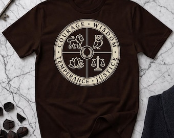 May include: A brown t-shirt featuring a circular design with the words "Courage, Wisdom, Temperance, Justice" surrounding a central emblem. The emblem includes a lion, an owl, a lotus flower, and scales.