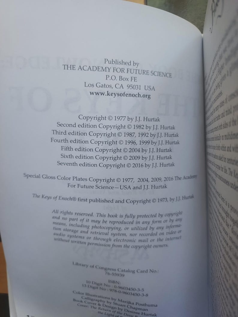 May include: Open book page with text detailing publication information. The text includes the publisher, The Academy For Future Science, copyright dates, and ISBN numbers. The book's title is "The Keys of Enoch".