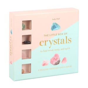 May include: A pink and blue box with the title "The Little Box of Crystals" and the text "to heal mind, body, and spirit". The box contains four healing crystals and a book.