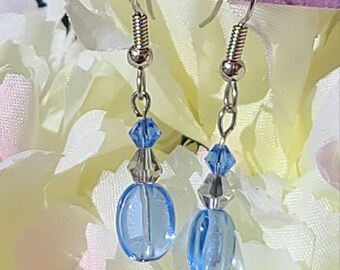 Dangling blue glass earrings with swarovski accent beads.