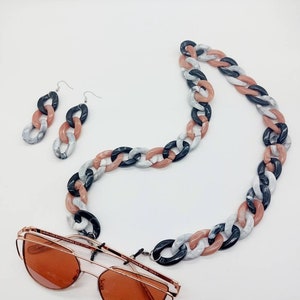 Eyeglass and phone chain. Eyeglasses cord, sunglasses strap. Snow mask chain. Phone cord, phone strap. Opaque acrylic chain. Earrings match.