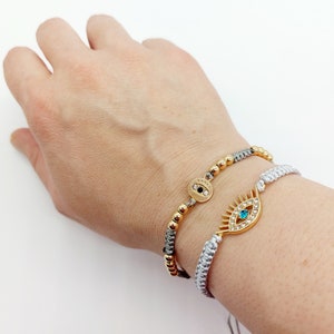 Evil eye bracelet. 18k gold plated evil eye charms. Good luck bracelet. String bracelets. Infinity charm. Heart charm. Evil eye charms.