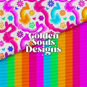 May include: A vibrant design featuring a patterned top with butterflies, rainbows, and flowers in pink, orange, and blue. Below, a striped fabric in rainbow colors transitions to a bright pink. The text "Golden Souls Designs" is centered.