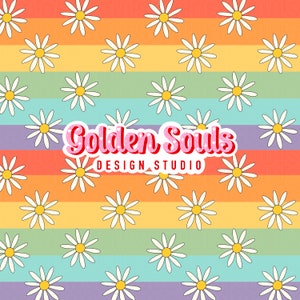 May include: A repeating pattern of white daisies with yellow centres on a rainbow striped background. The text "Golden Souls Design Studio" is in the centre of the image.