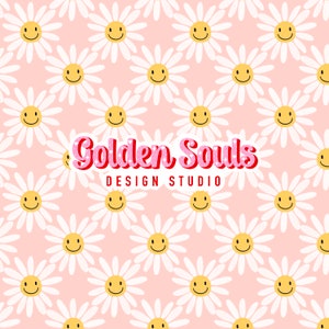 May include: A pink background with a repeating pattern of white daisies with yellow smiley faces. The text "Golden Souls DESIGN STUDIO" is in the center of the image.