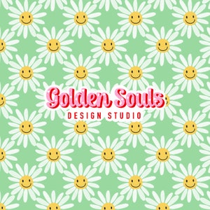 May include: A green background with a repeating pattern of white daisies with yellow smiley faces. The text "Golden Souls: DESIGN STUDIO" is in the center of the image.