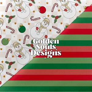 May include: A white background with a repeating pattern of snowmen, candy canes, holly, ornaments, and stars. The pattern is cut off by a diagonal red and green striped pattern. The text "Golden Souls Designs" is in the center of the image.