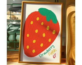 Puede incluir: Una impresión enmarcada de una fresa roja y verde con semillas amarillas. El texto "Strawberry Fields 67'" está escrito debajo de la fresa.
