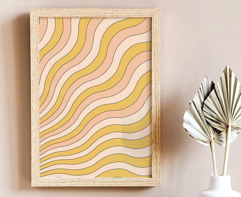 May include: A framed print with a retro-style design of wavy lines in shades of yellow and pink.