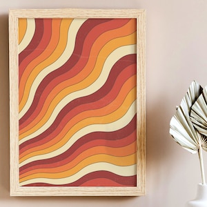 May include: A framed print with a retro design featuring wavy lines in shades of orange, red, and yellow.