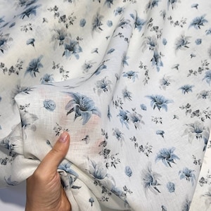 Italian linen fabric by the yard with blue floral print on white, Cruise collection, apparel fashion alta moda fabric with ornament