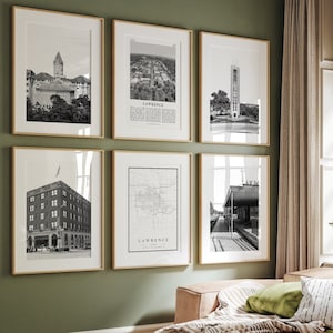 May include: A living room with a green wall and a light brown couch. There are six black and white framed prints on the wall, including a map of Lawrence, Kansas. The prints are arranged in a grid pattern.