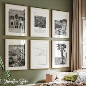 May include: A gallery wall featuring six framed black and white photographs of Split, Croatia. The images include an aerial view of the city, a close-up of a building, and a palm tree.