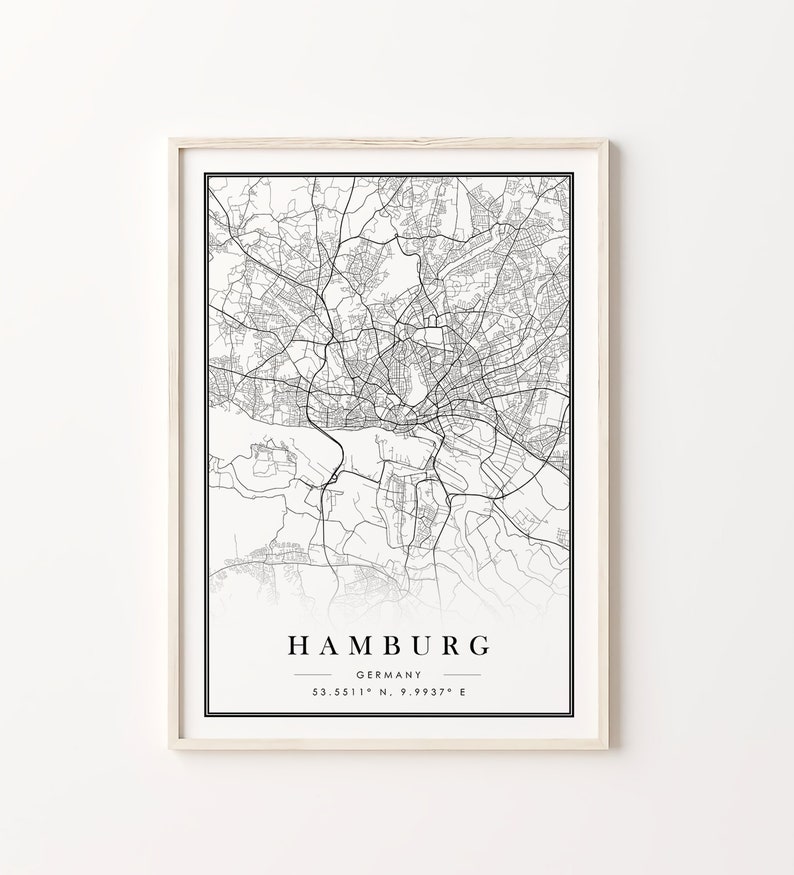 May include: A black and white map print of Hamburg, Germany, with the city name and coordinates "53.5511&deg; N, 9.9937&deg; E" printed below the map.