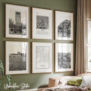 May include: A gallery wall of six black and white framed photographs of Tempe, Arizona. The photos include a view of the Arizona State University campus, a map of Tempe, and aerial views of the city.