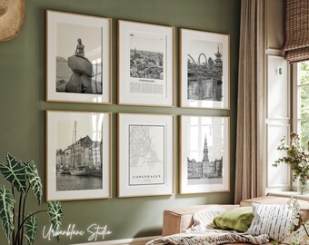 May include: A set of six black and white framed prints featuring various scenes from Copenhagen, Denmark. The prints include a map of the city, a view of the Little Mermaid statue, and a view of the Tivoli Gardens amusement park.