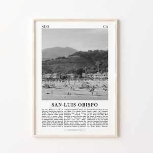 May include: Black and white photograph of a beach scene in San Luis Obispo, California. The photo shows a beach with people, houses, and a mountain in the background. The text "San Luis Obispo" is printed below the image.