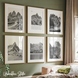 May include: A set of six black and white framed photographs of mountain ranges. The frames are all the same size and are arranged in a grid pattern on a green wall. The photographs are all of different mountain ranges, but they all have a similar style. The photographs are all in black and white and have a vintage feel.