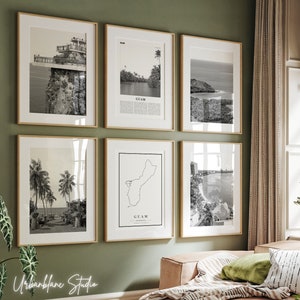 May include: A set of six black and white framed prints featuring various scenes from Guam. The prints are arranged in a grid pattern on a green wall. The prints include a view of a cliff, a beach, a map of Guam, and a palm tree lined path.