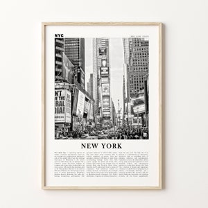 May include: Black and white framed print depicting Times Square, New York City. The image shows a bustling street scene with billboards, buildings, and traffic. The word "NEW YORK" is printed in large letters at the bottom.