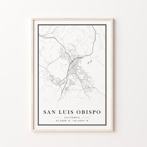 May include: Black and white line art map of San Luis Obispo, California. The map shows the city streets and surrounding area. The text "San Luis Obispo, California 35.2828&deg; N, 120.6596&deg; W" is printed below the map.