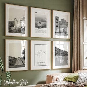 May include: A set of six black and white framed prints featuring images of Honduras. The prints include a map of Honduras, a church, a building, and a landscape.