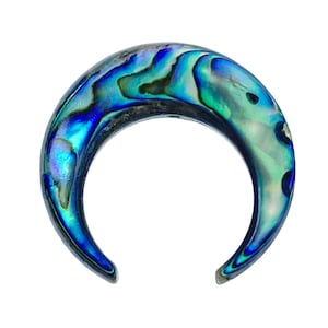 May include: A crescent moon shaped piece of jewelry made from iridescent abalone shell. The shell has shades of blue, green, and black.