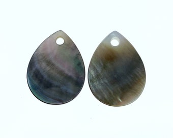 May include: Two black and iridescent teardrop-shaped shell pendants with a hole at the top for stringing.