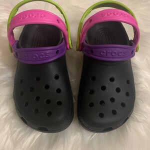 green and purple crocs