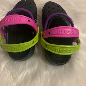 green and purple crocs