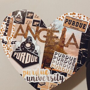May include: A heart-shaped collage with a gold glitter background and various Purdue University stickers, including the school logo, the words "Purdue University", and "Boiler Up".