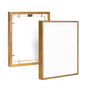 Könnte beinhalten: Zwei goldfarbene Bilderrahmen, einer mit einem weißen Leinwand-Einsatz und der andere leer. Beide Rahmen haben ein schlichtes, rechteckiges Design.