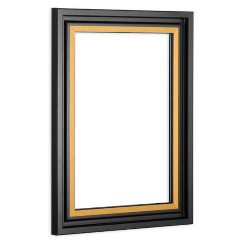 May include: A black picture frame with a gold inner border. The frame is rectangular and has a simple design.