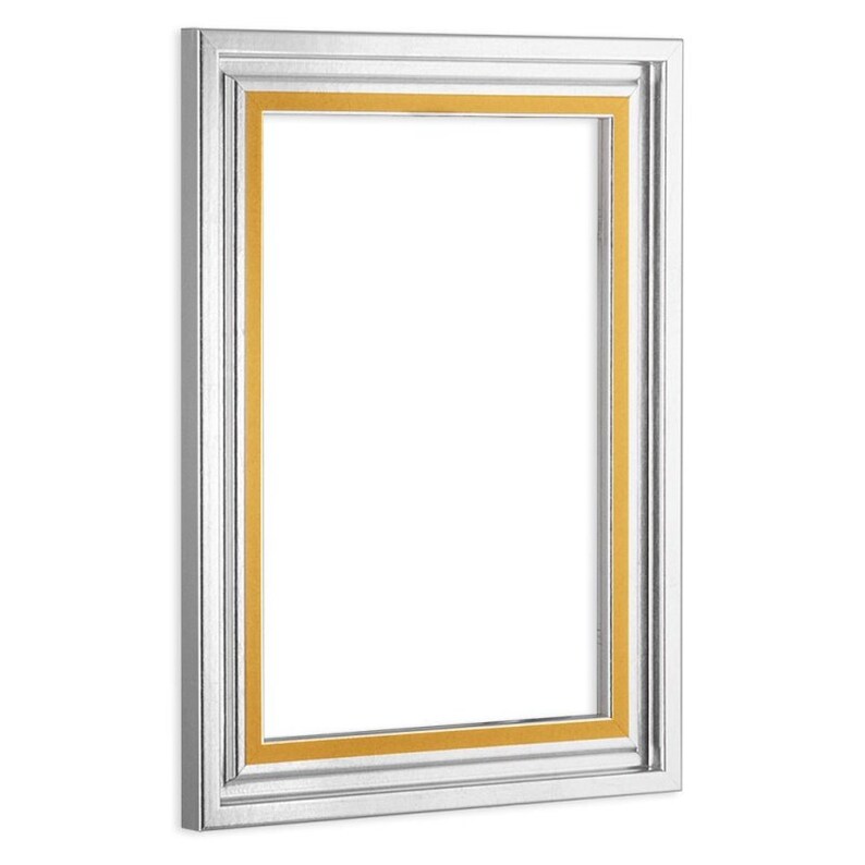 May include: A silver picture frame with a gold inner border. The frame has a simple, classic design.