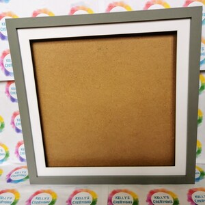 May include: A gray picture frame with a white mat. The frame is made of wood and has a simple design. The mat is a standard size and is designed to hold a photo or artwork.