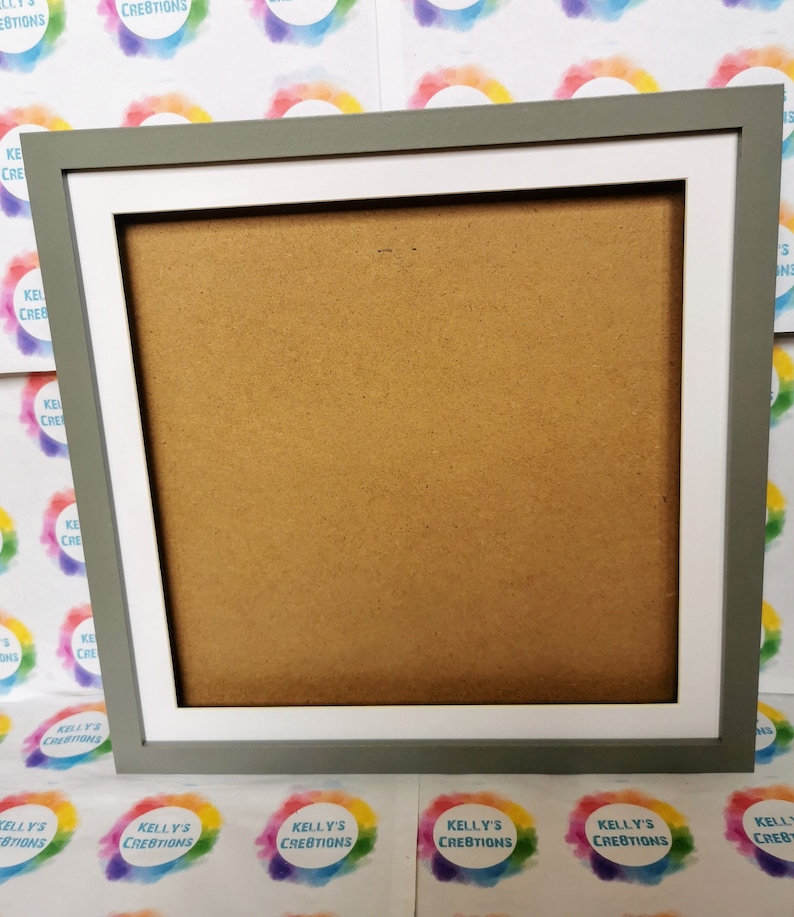 May include: A gray picture frame with a white mat. The frame is made of wood and has a simple design. The mat is a standard size and is designed to hold a photo or artwork.
